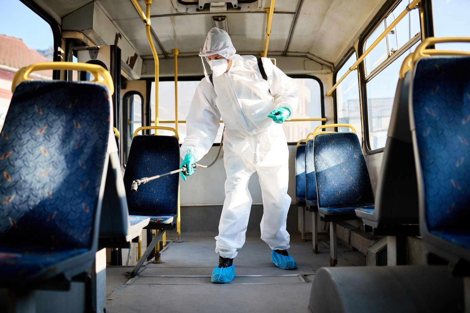 Disinfectant Worker Spraying Inside Public Bus Due Coronavirus Pandemic 1 Scaled