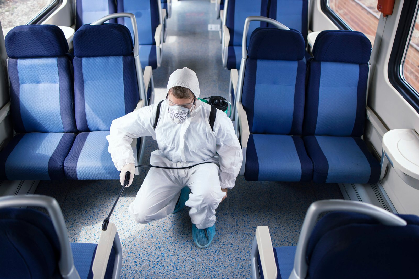 Man White Protection Suit Disinfecting Sanitizing Subway Train Interior Stop Spreading Highly Contagious Corona Virus Scaled